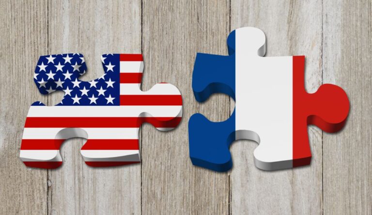 Relationship between the USA and France, Two puzzle pieces with the flags of USA and France on weathered wood