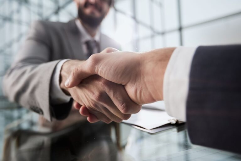 two businessmen shaking hands