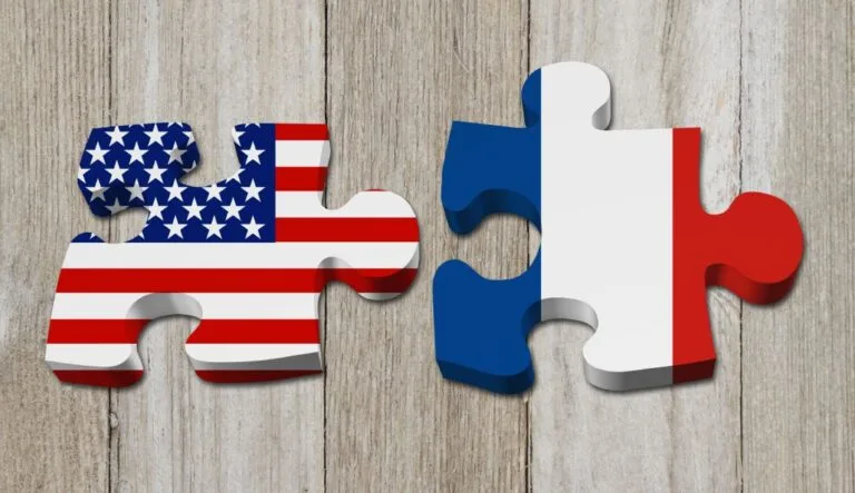 Relationship between the USA and France, Two puzzle pieces with the flags of USA and France on weathered wood